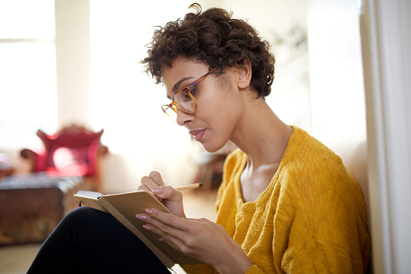 woman sitting and journaling