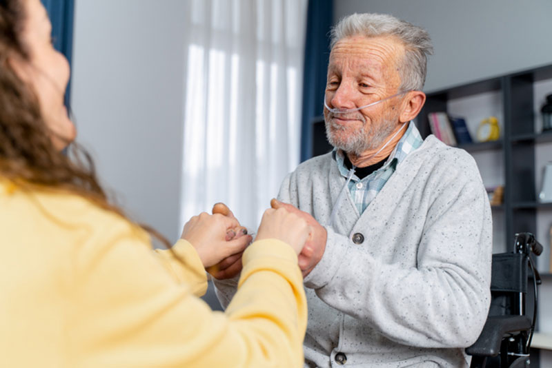 A woman works at enhancing life with COPD for her aging father.